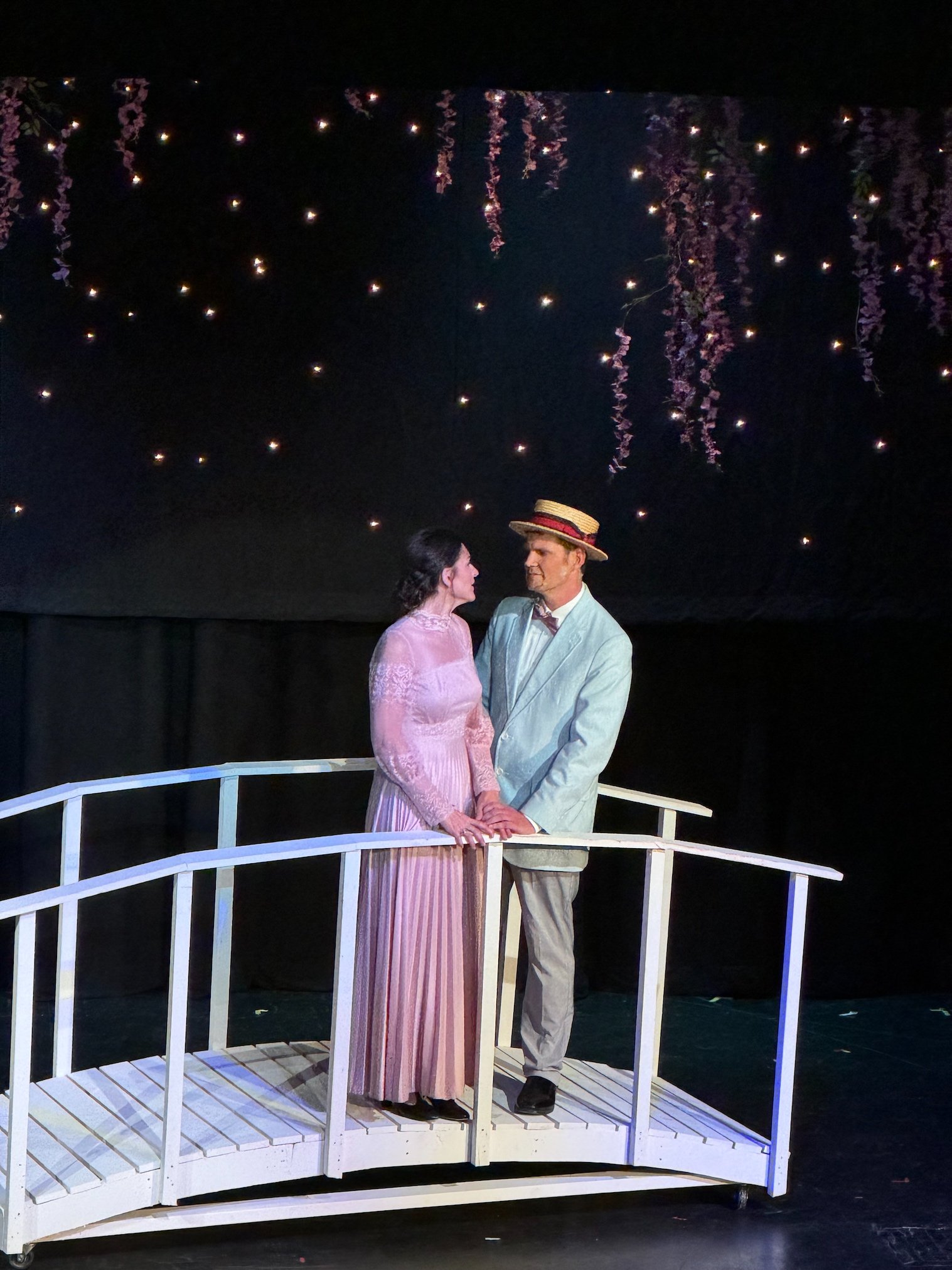 Marion and Harold on the bridge looking at each other